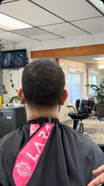 Back of a client's head showing a short, even haircut with a tidy neckline