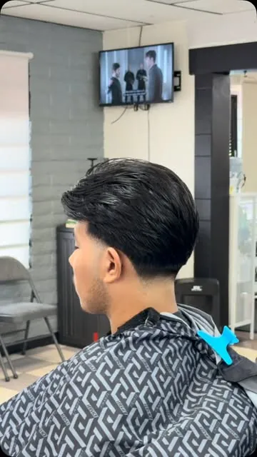 Side view of a swept-back style with a tapered neckline